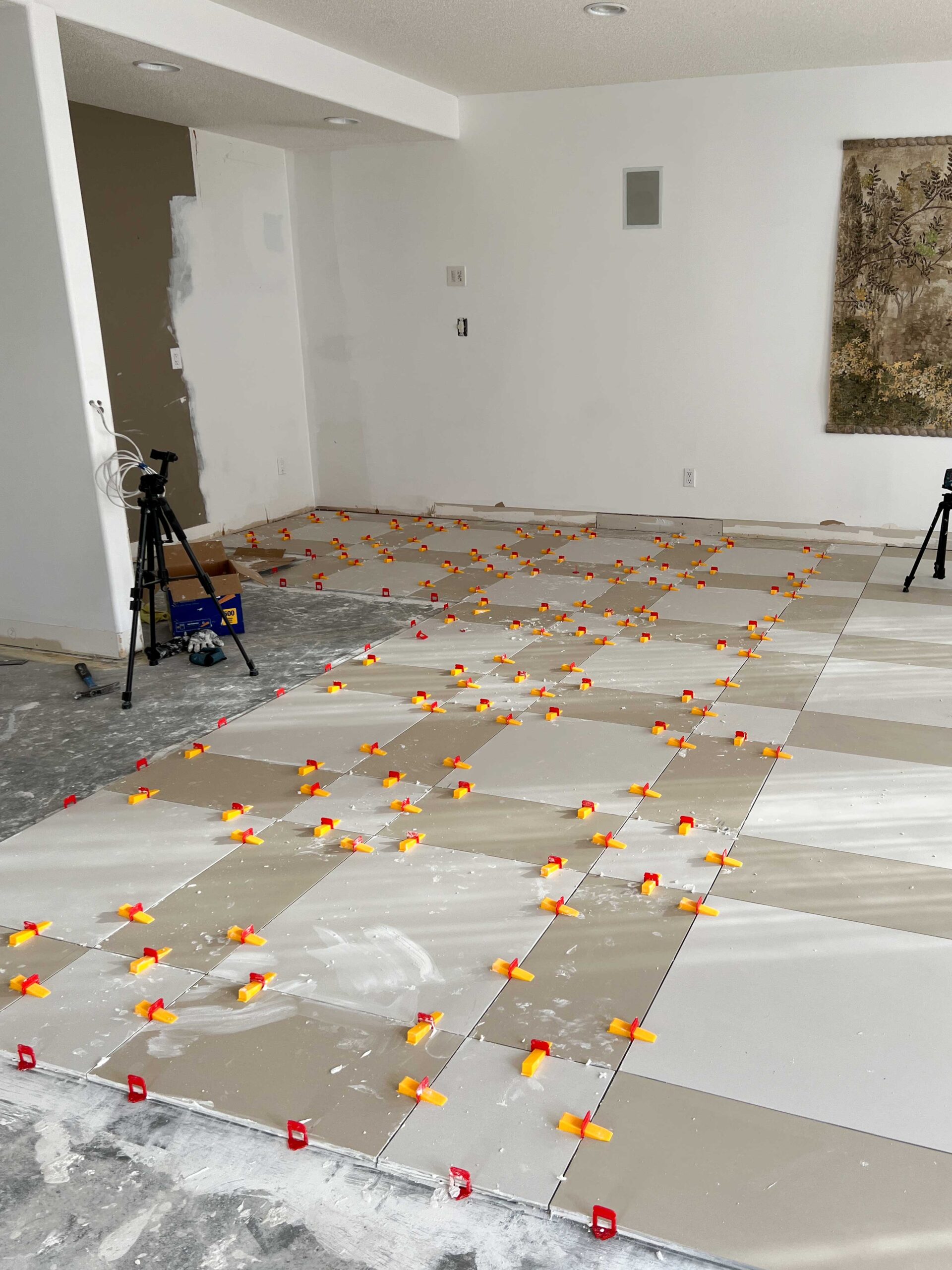 view of partially installed large format tile floor