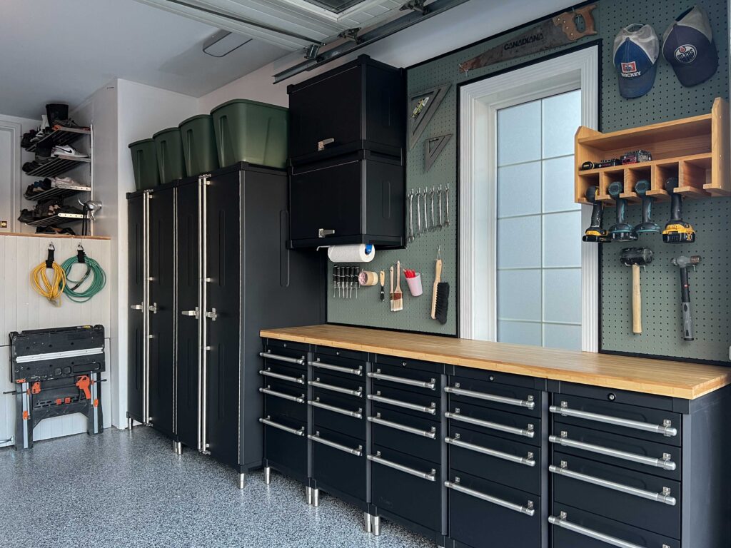 Black Garage cabinets with green pegboard