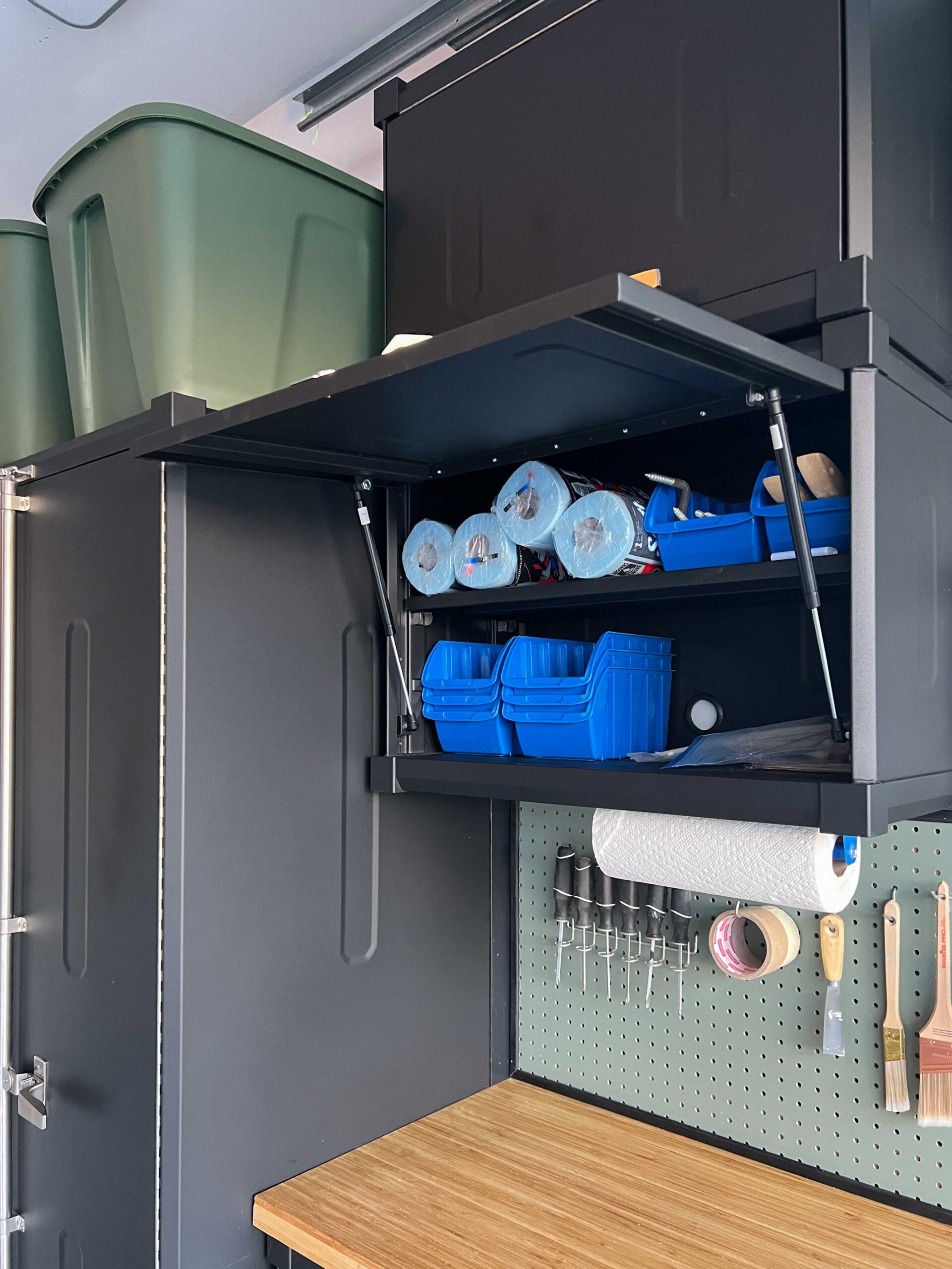 garage cabinet open with tools inside