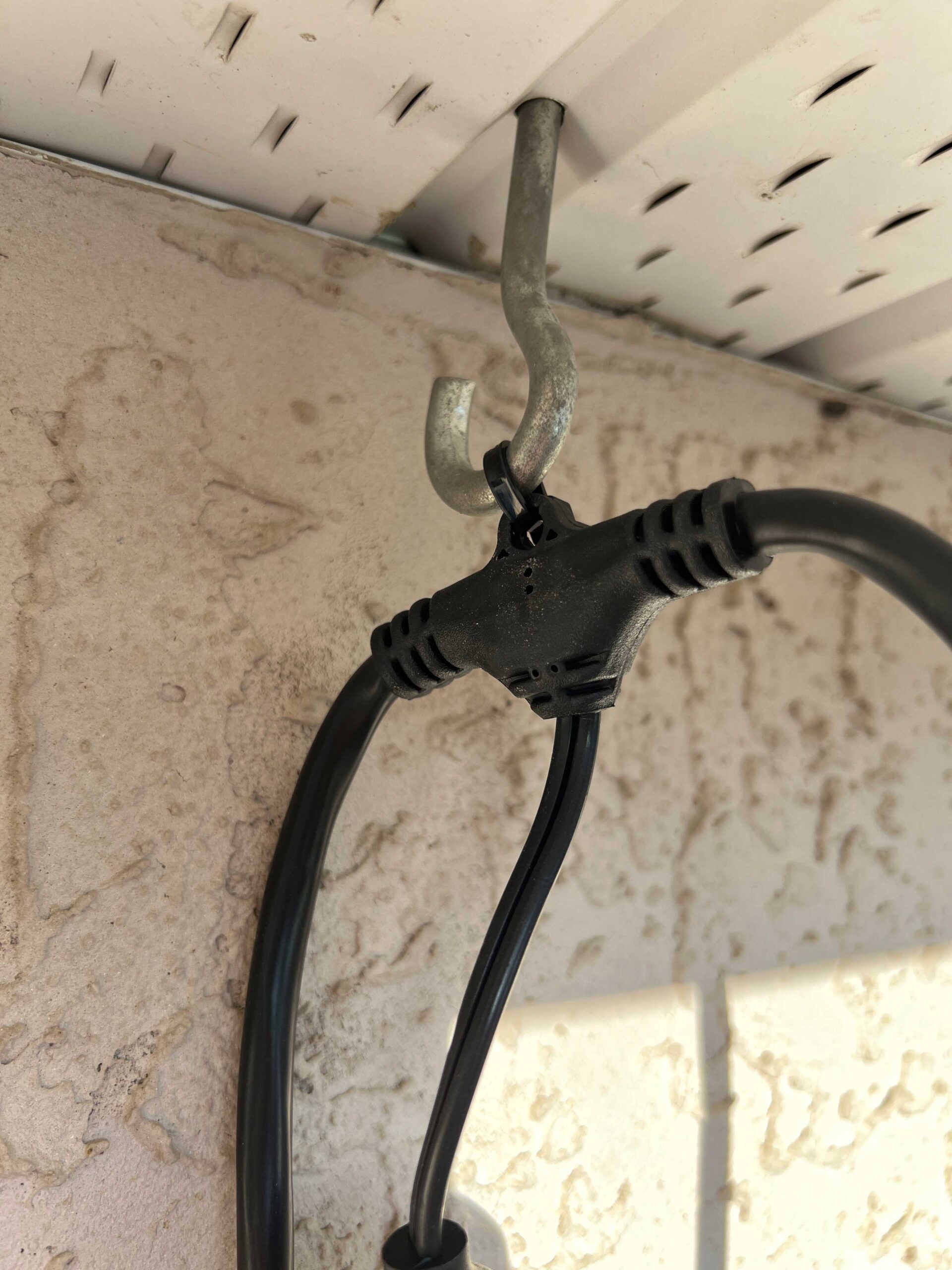 Hook screwed into underside of house