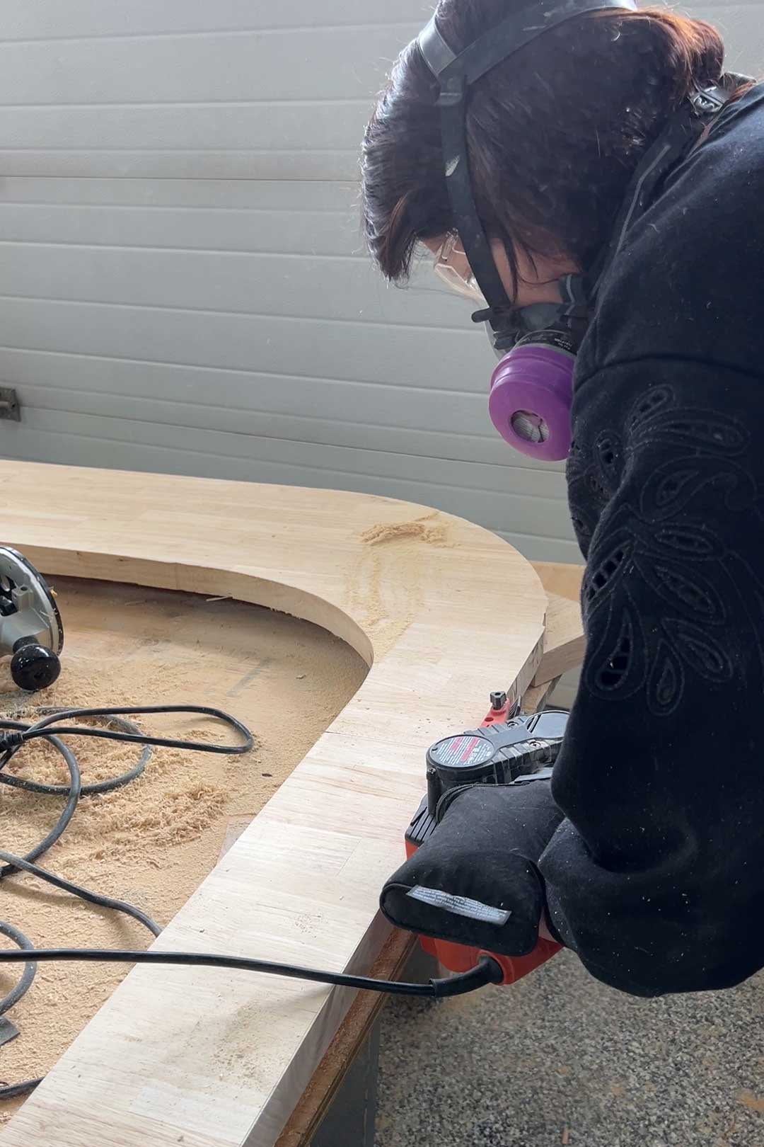 Sanding edge of butcherblock with belt sander
