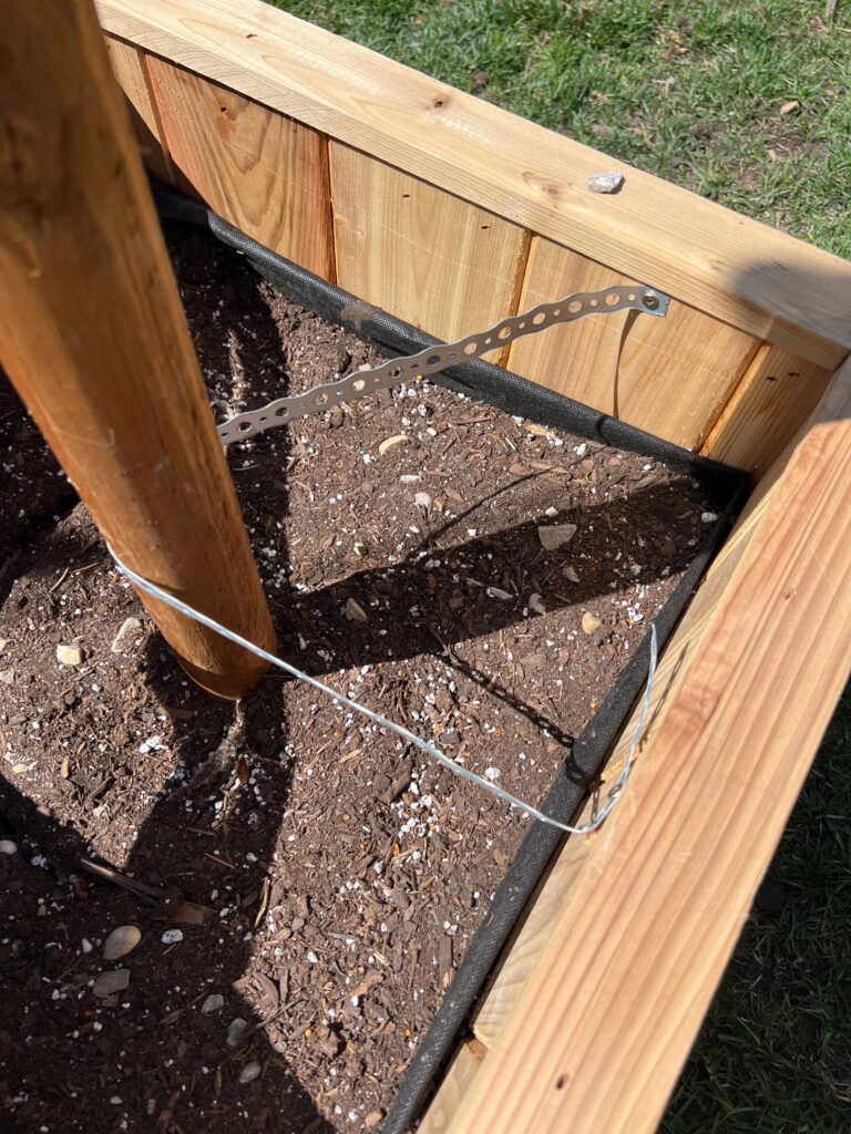 galvanized strapping holding poles straight