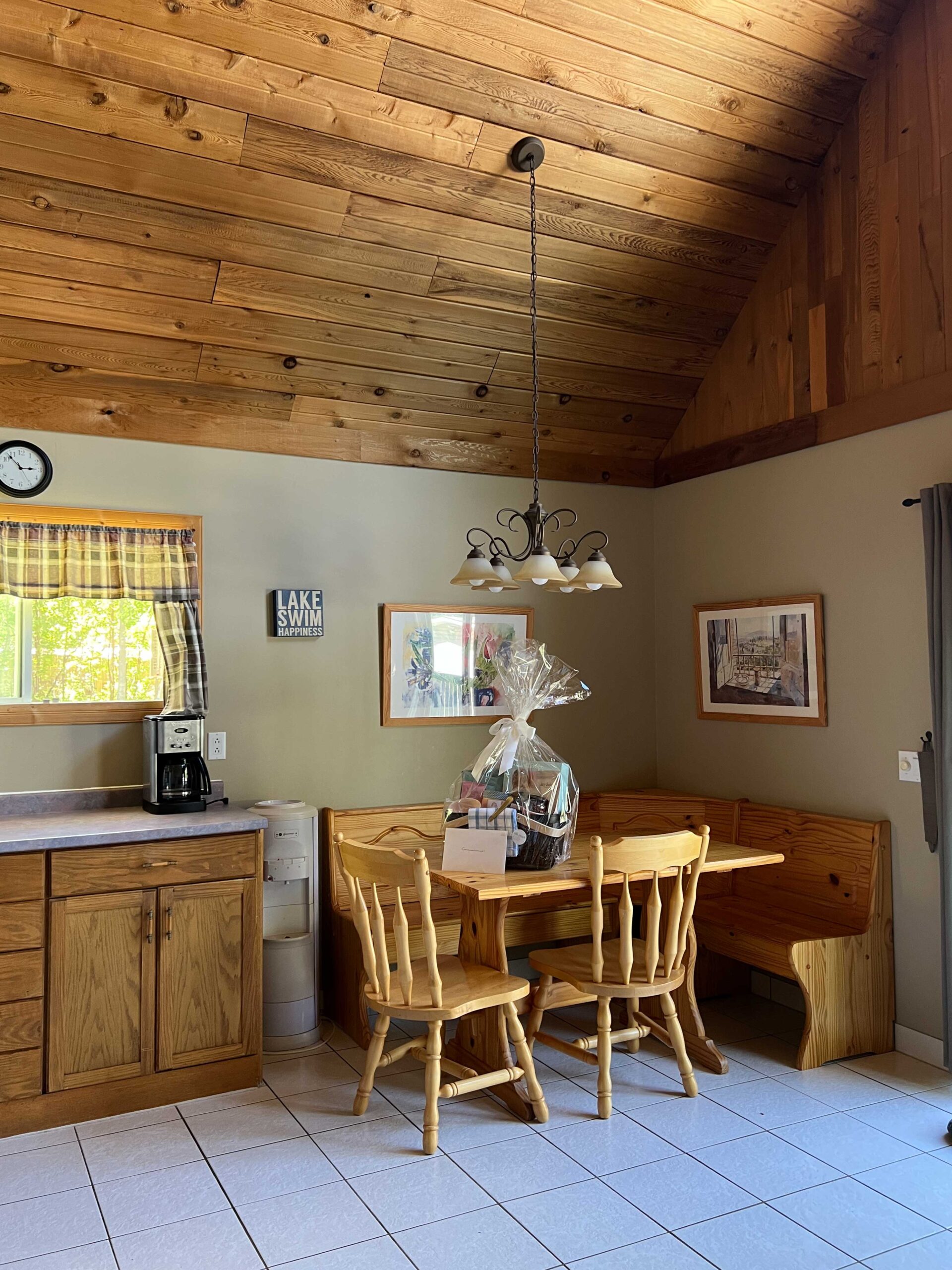 cabin with wood corner banquette and wood ceilings