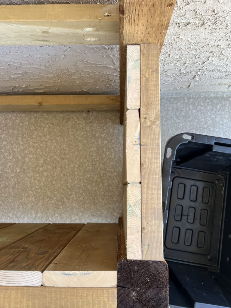 Deck boards are screwed to the inside of the frame for strength and a slatted look.