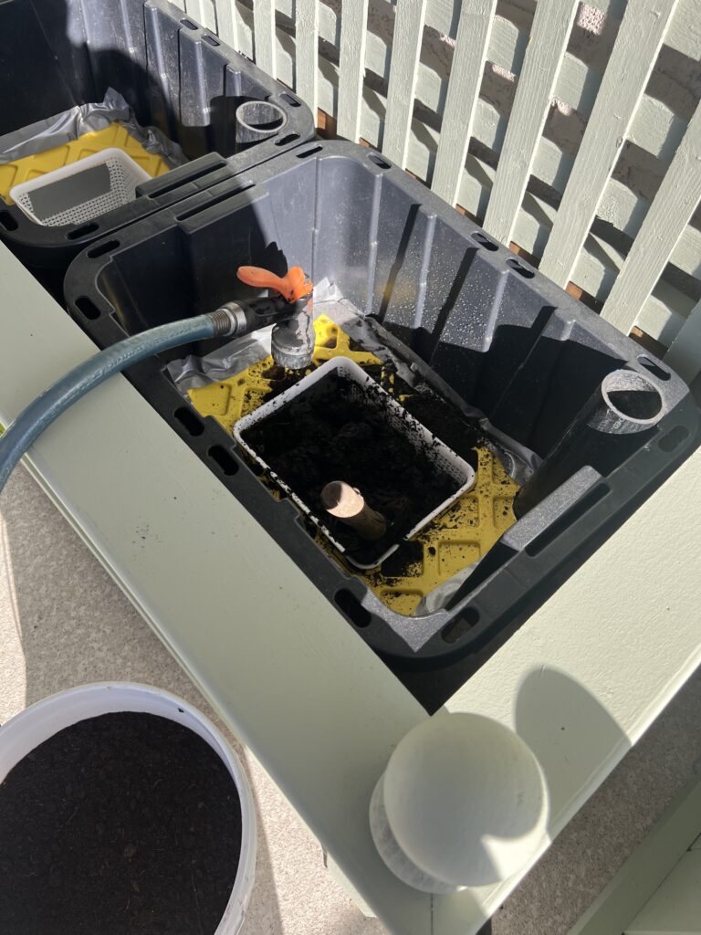 A self watering system is built into the totes before the plants are planted.