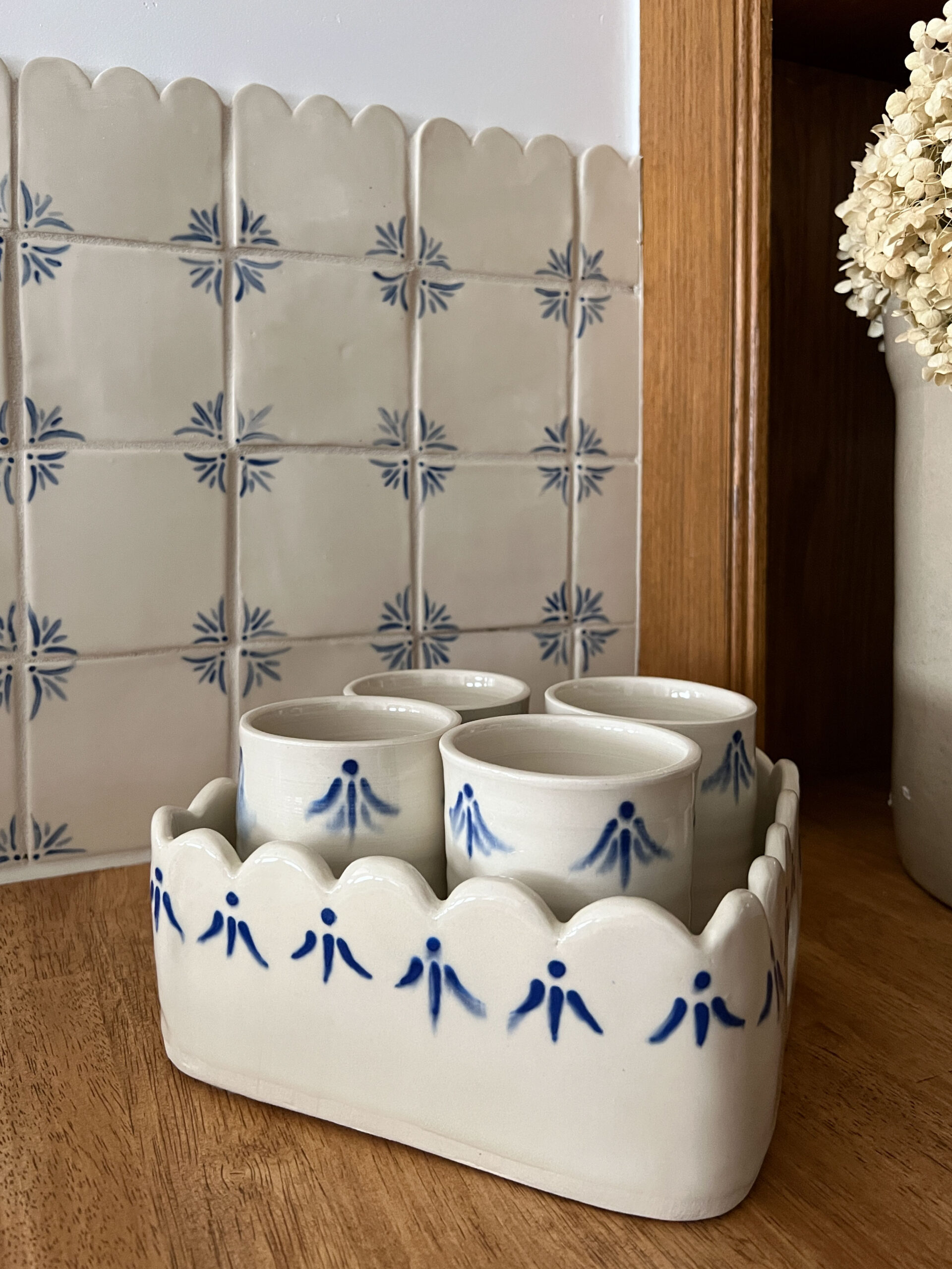 scalloped ceramic tray with glasses that match the tile