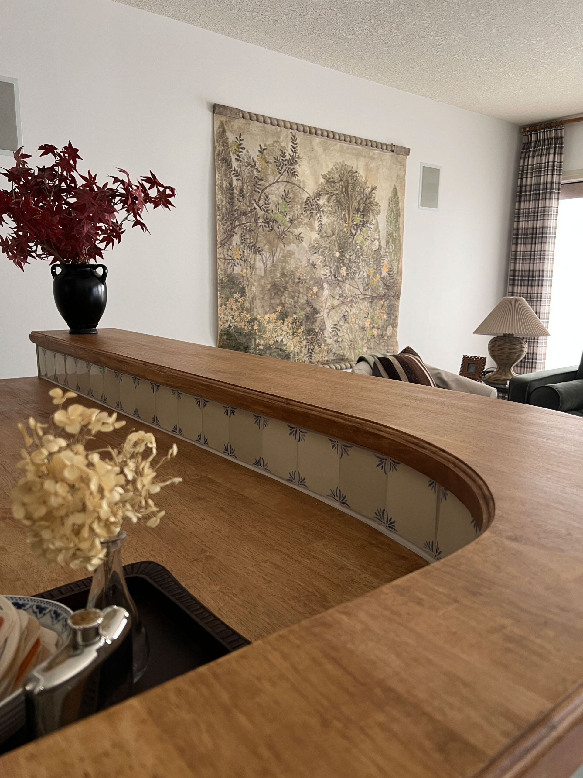 Curved countertop with delft tile backsplash