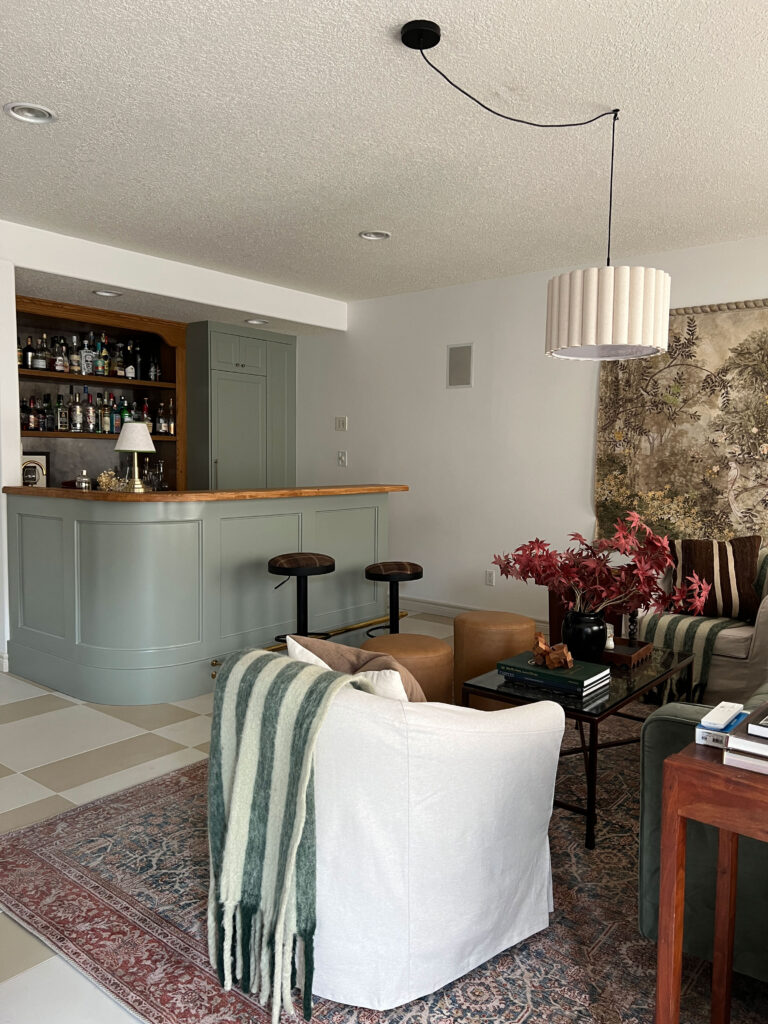 Finished DIY bar with living room in foreground