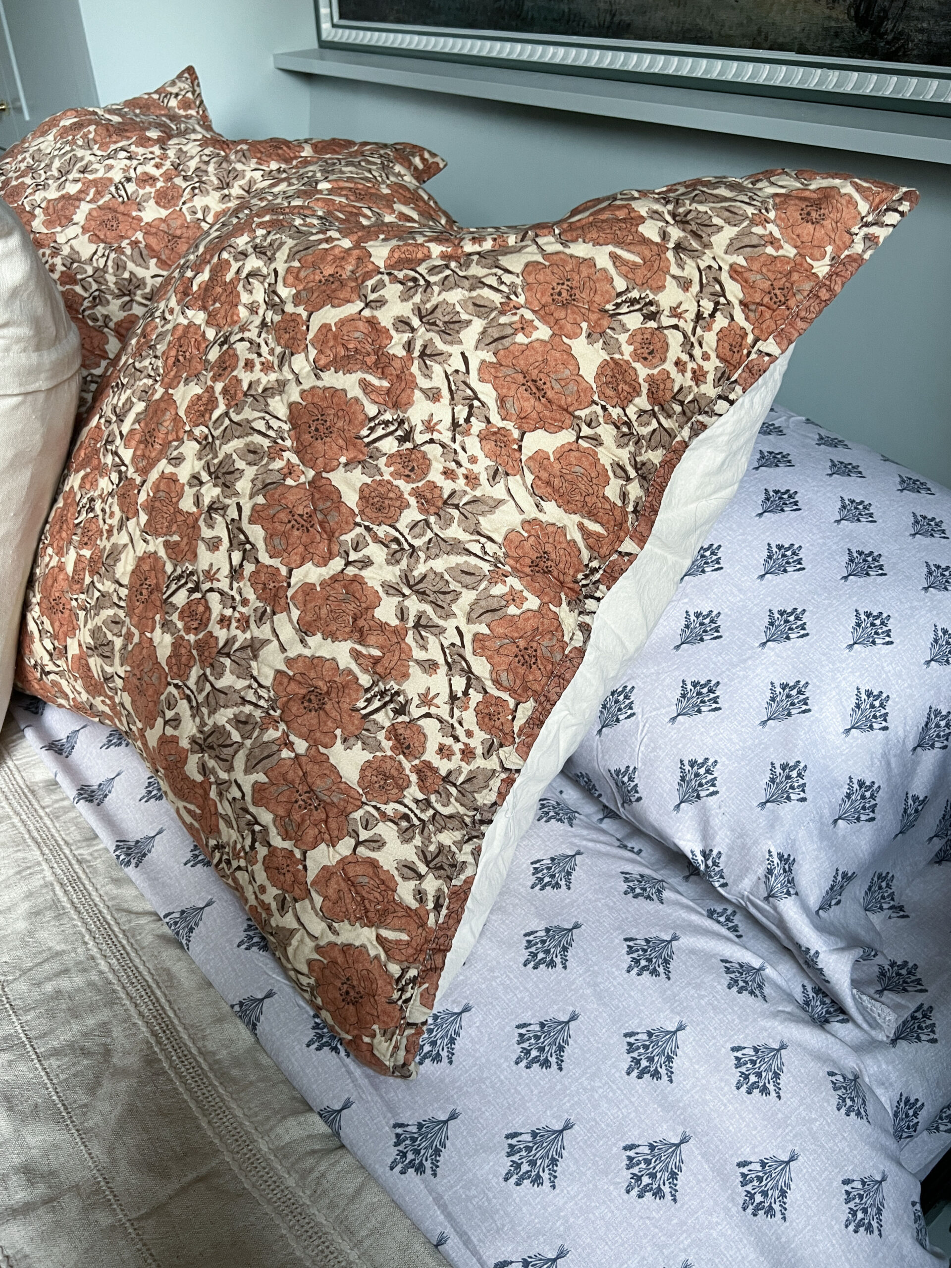 Close up of patterned sheets and pillows