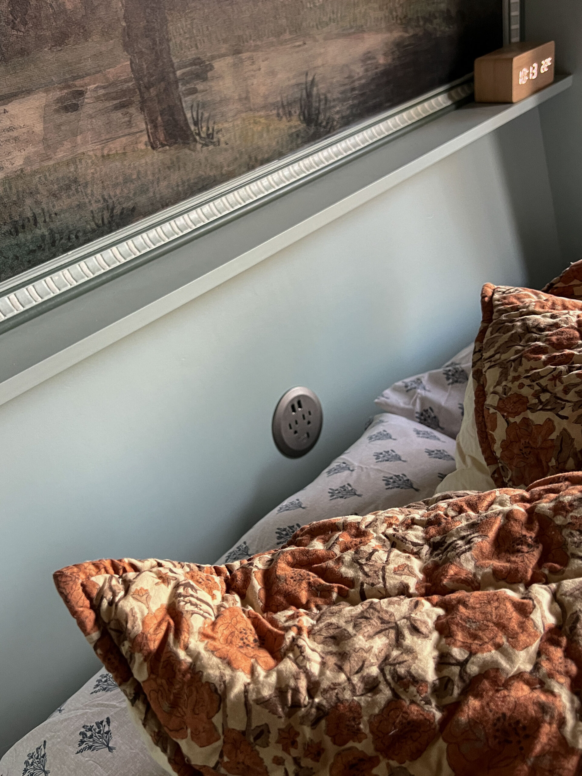 Installed grommet style plug in the back of a headboard