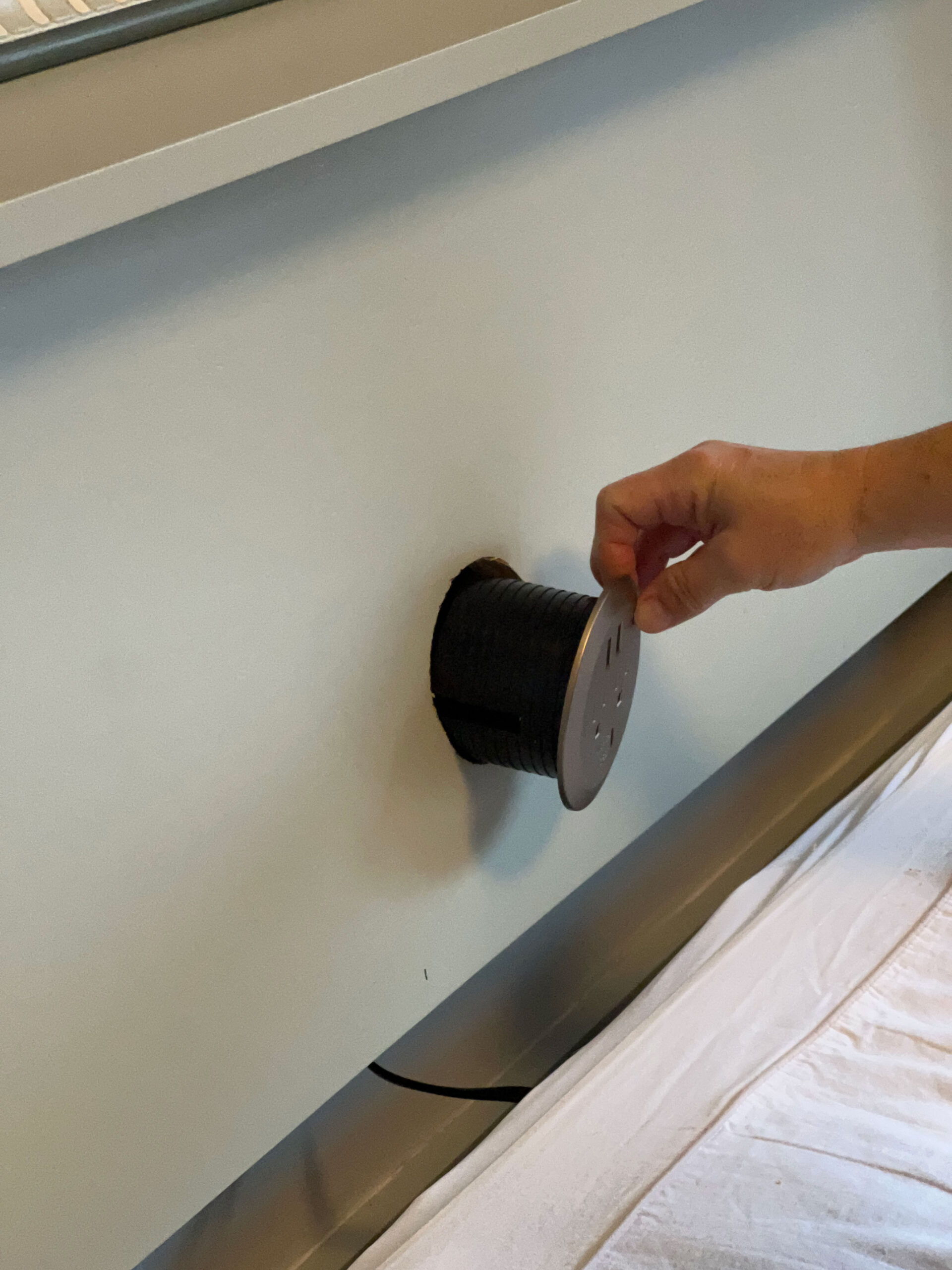 installing a grommet style plug in the back of a headboard