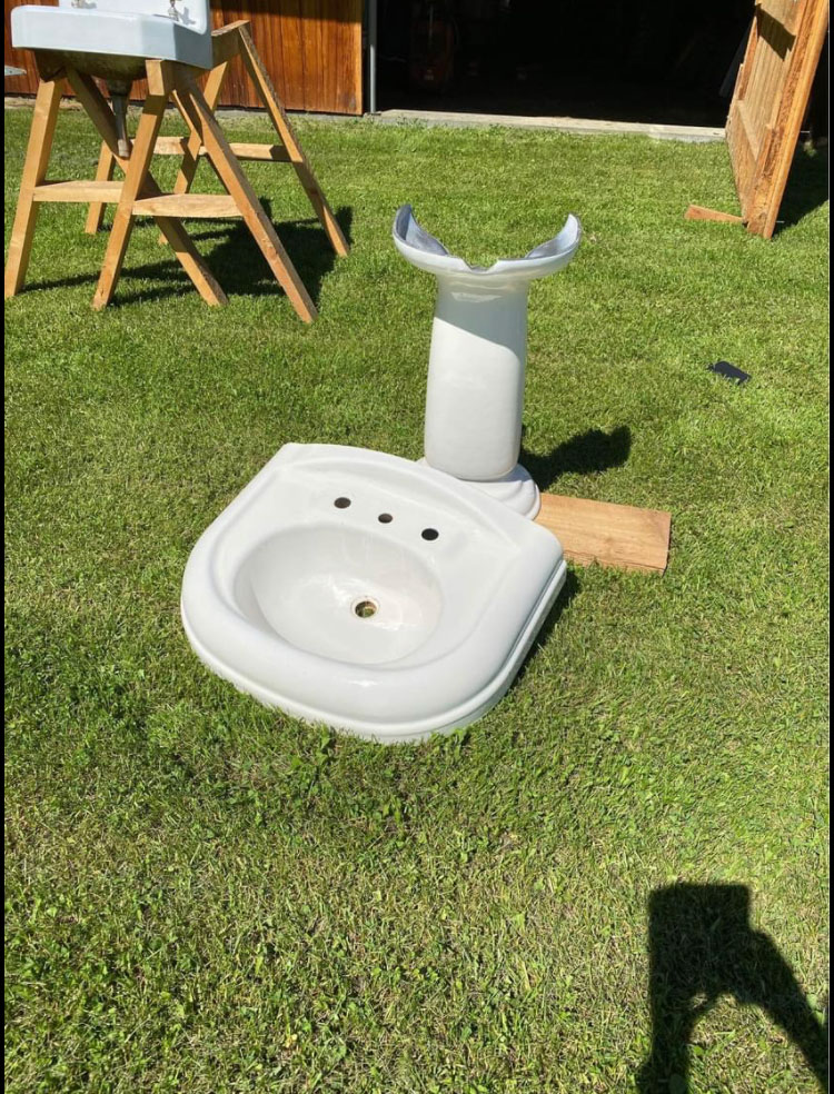 sink in two pieces on the grass