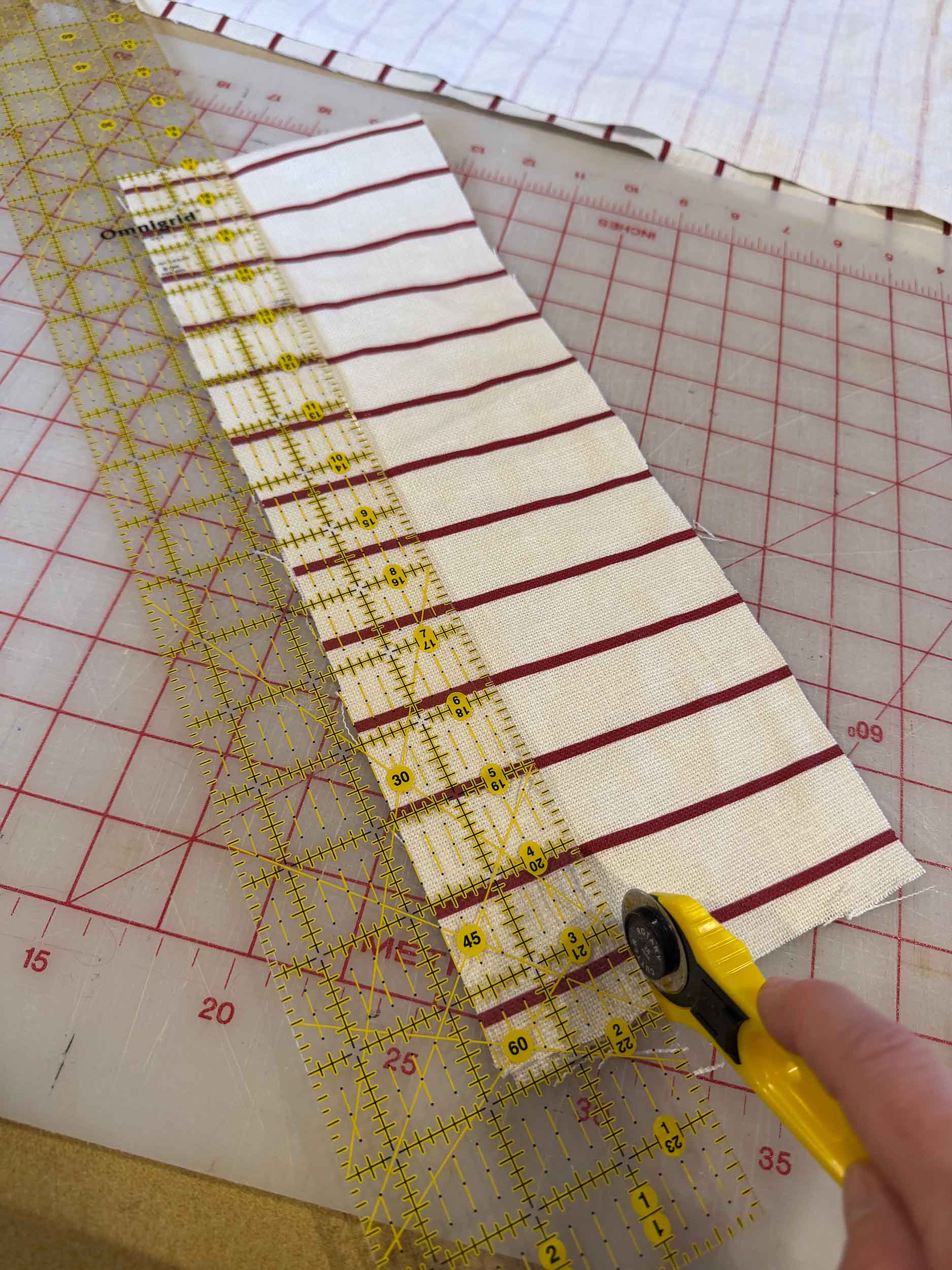 Cutting strips of striped fabric