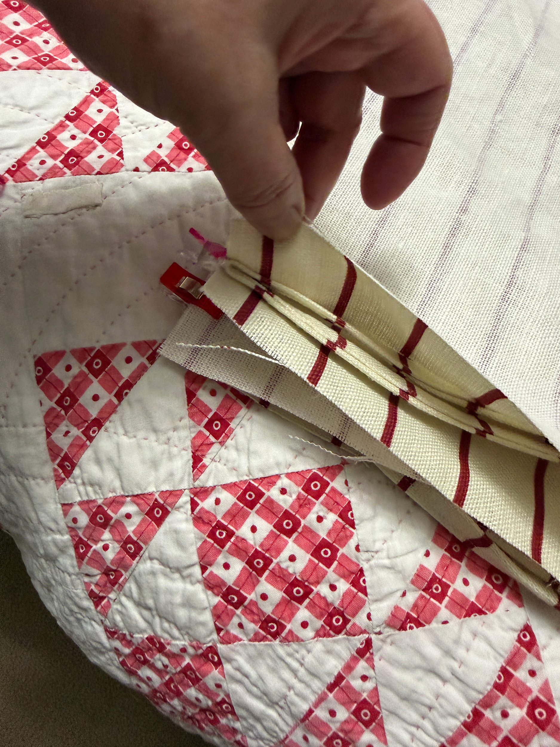 headboard pillow pinned together with ties on the inside