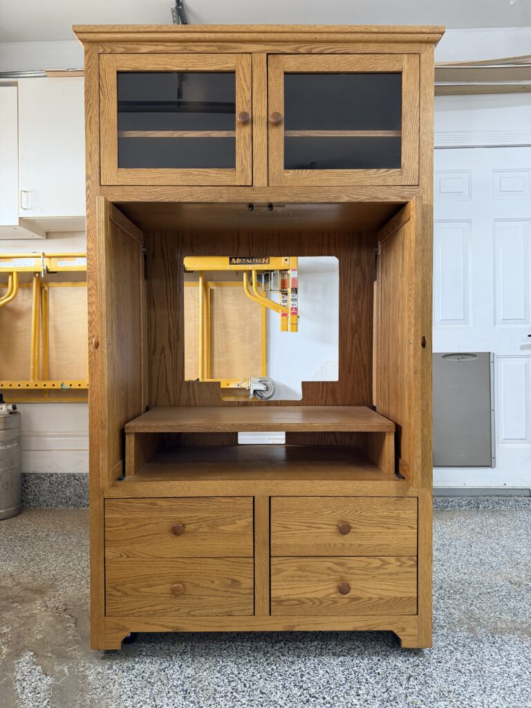 The armoire before the makeover, with the doors open.
