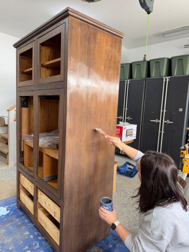 Staining the new DIY coffee bar in a darker finish.