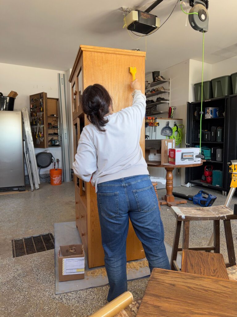 Using a paint stripper on the outside of the cabinet.