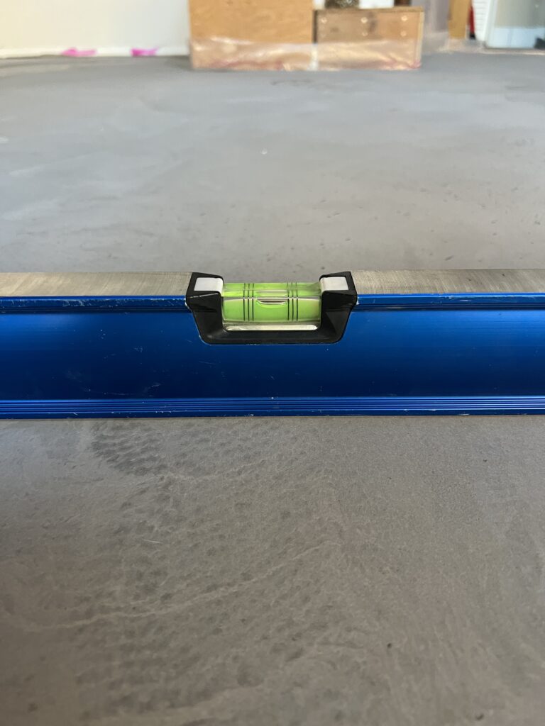 Close up of a level on a self levelling concrete floor