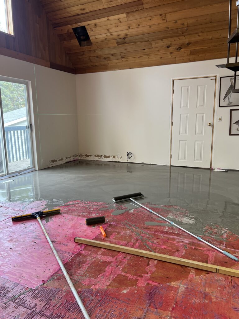 The self levelling concrete after it's been spread on the floor