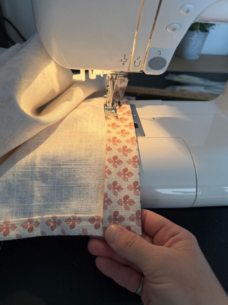 Sewing door curtains with a hem.