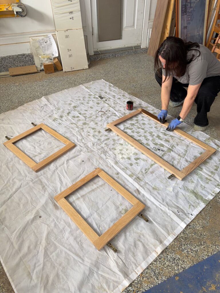 Staining the door pieces of the DIY coffee bar.