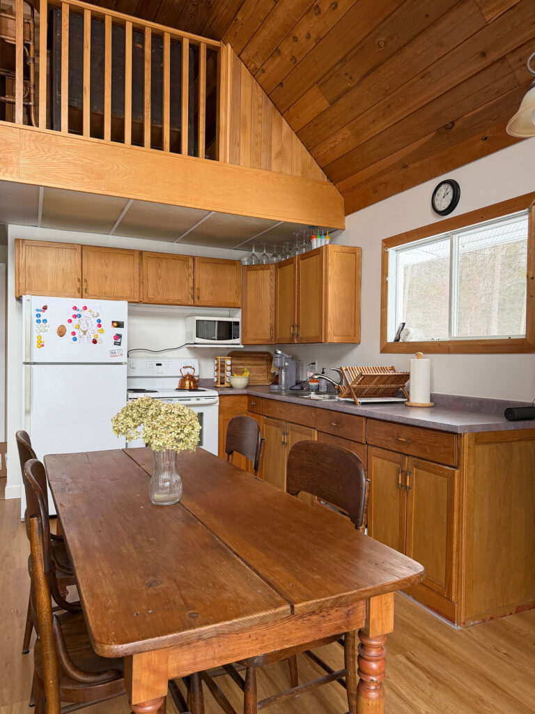 kitchen with wood cabinets, wood ceiling