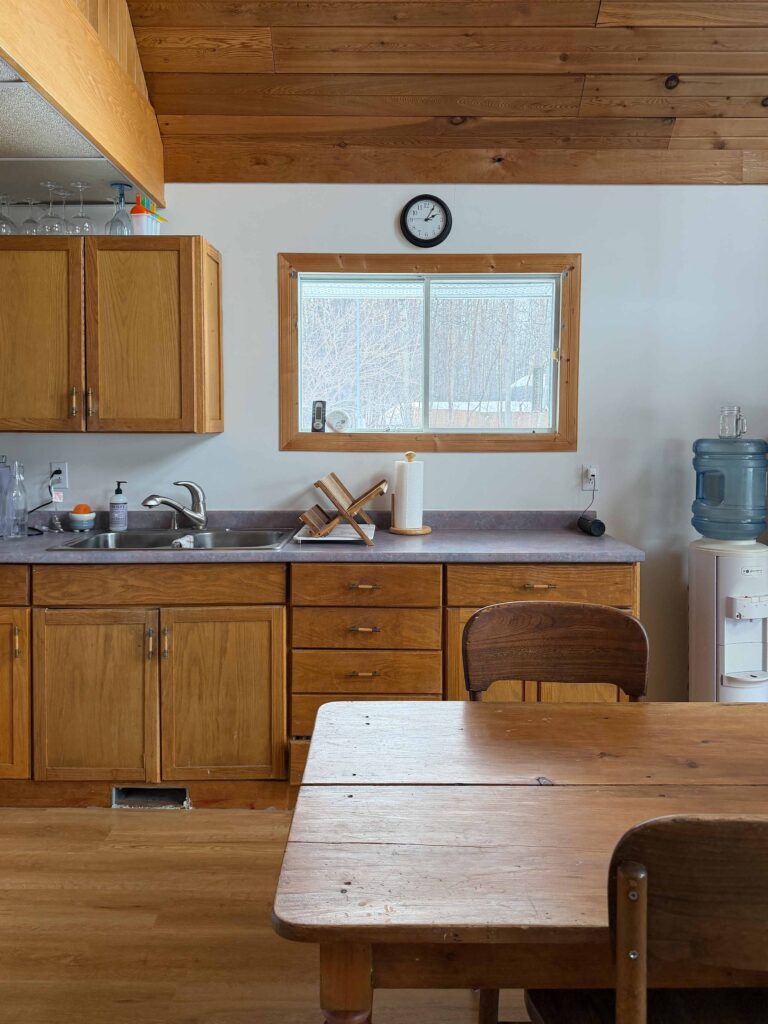 kitchen with wood cabinets, wood ceiling