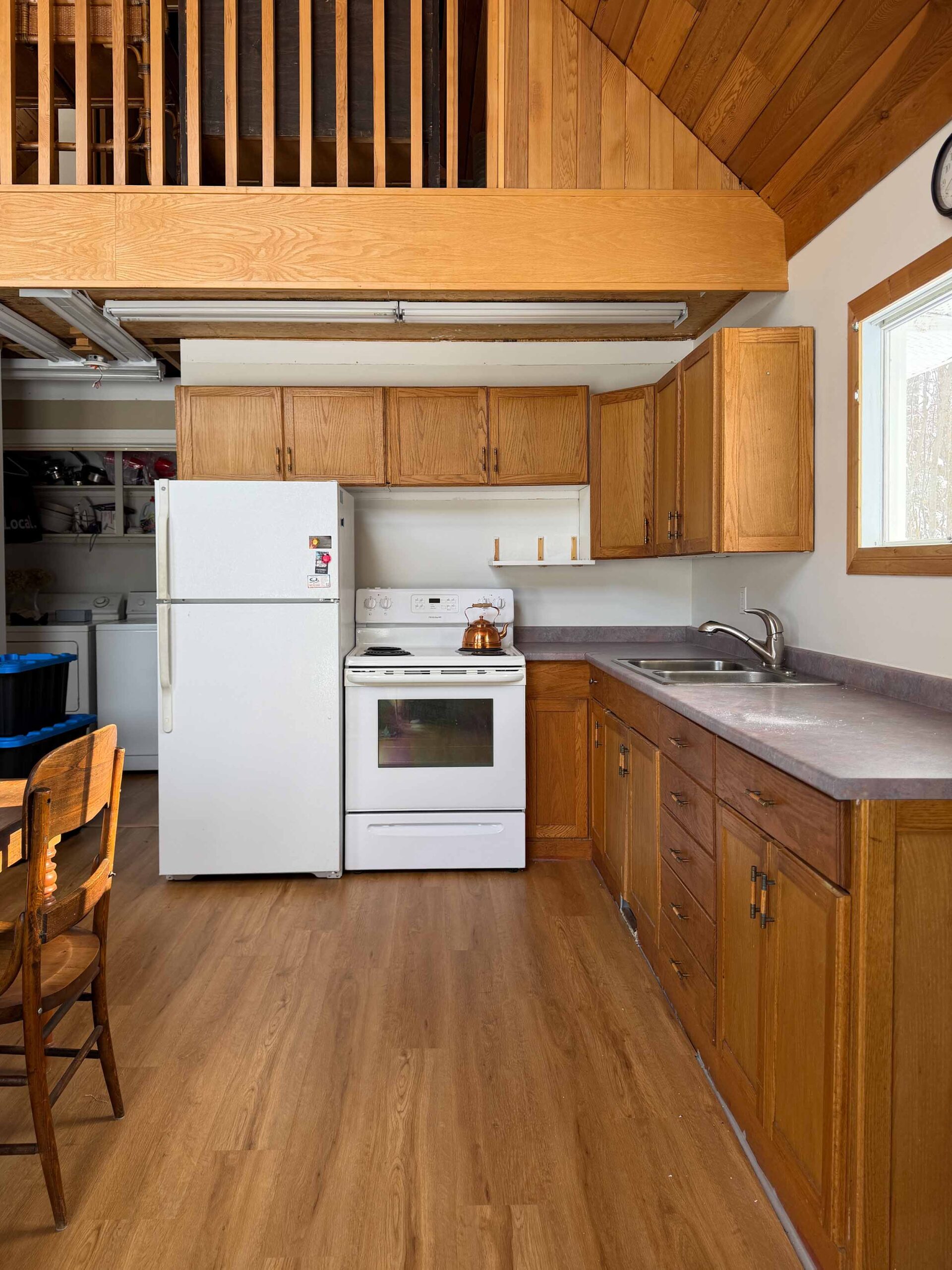 kitchen with wood cabinets, wood ceiling