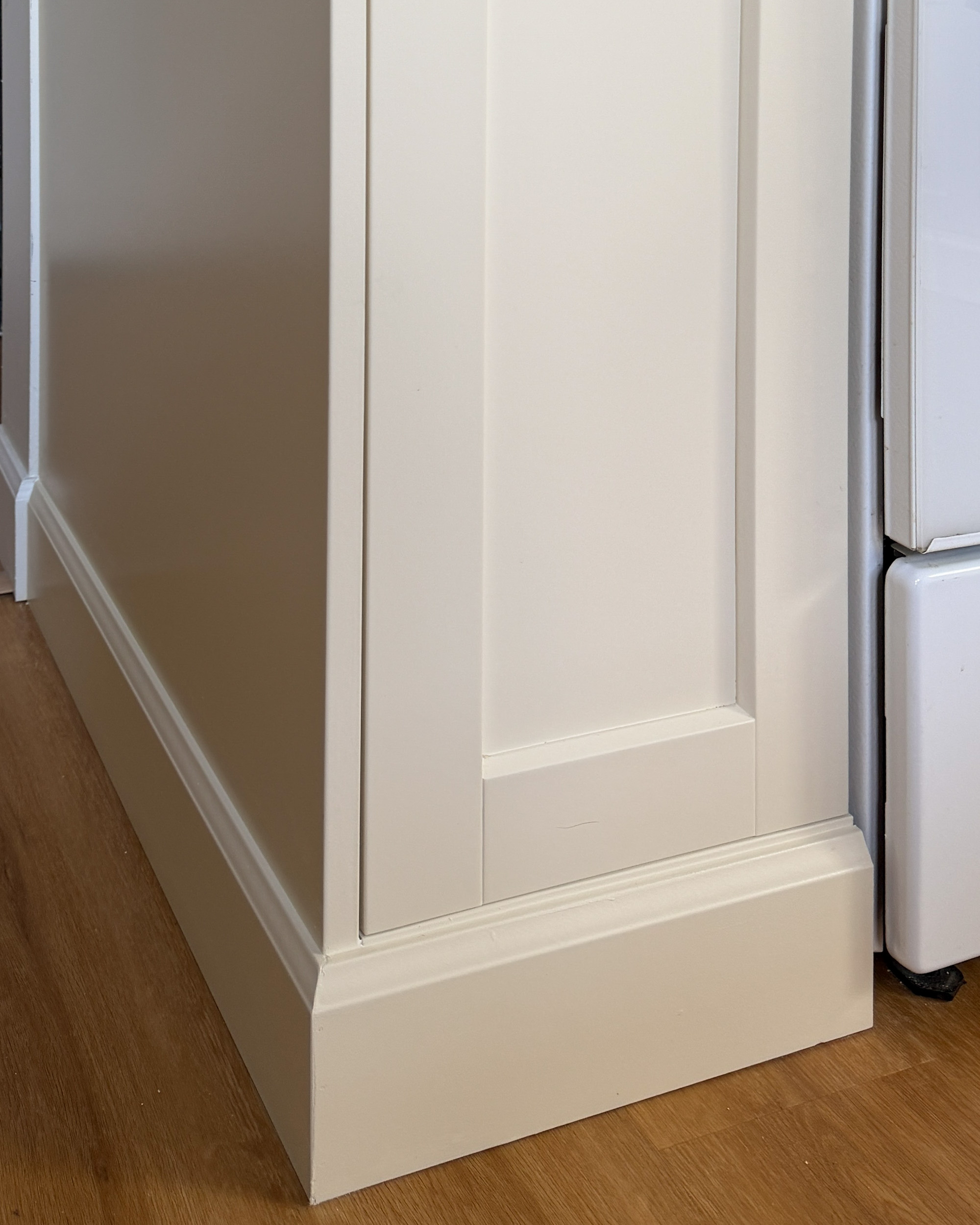 cabinet with a baseboard furniture style toe kick