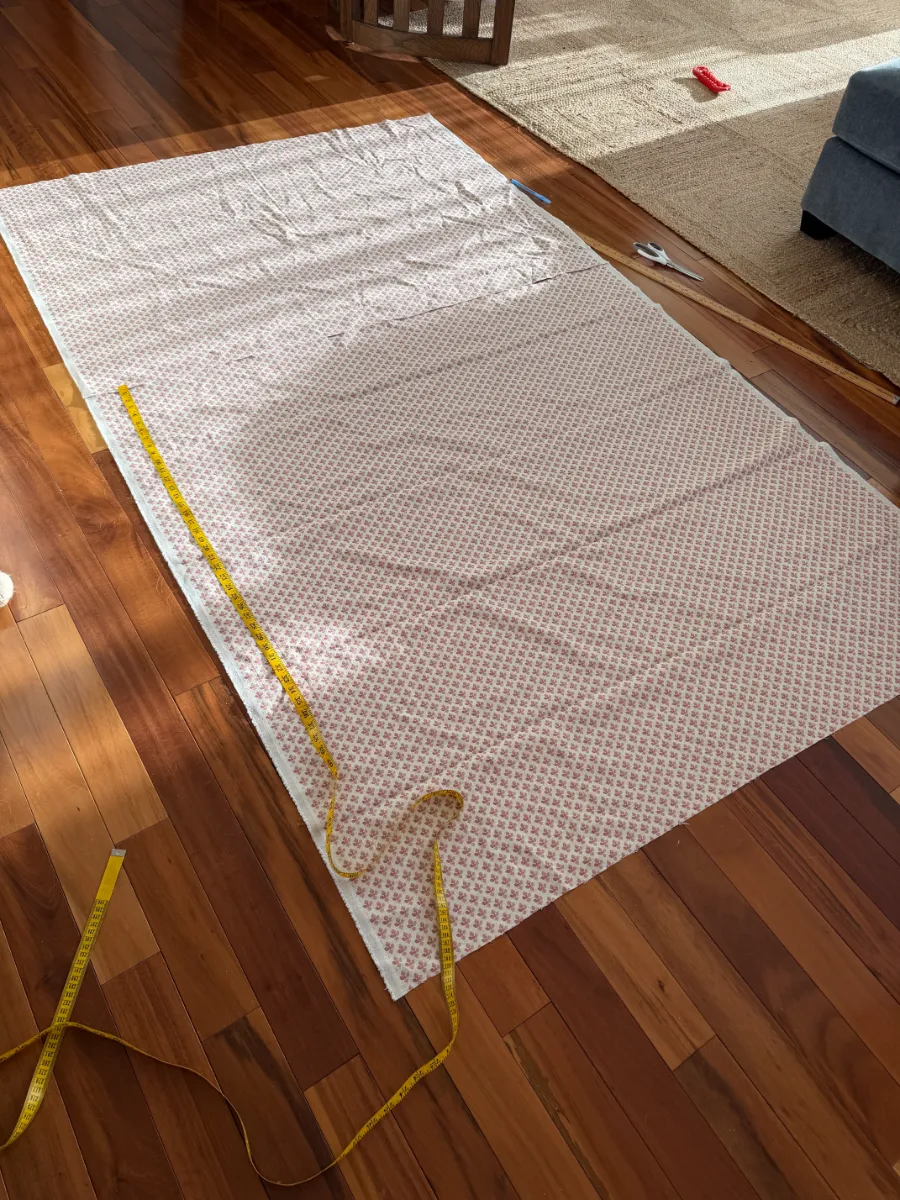 Fabric on floor with a measuring tape
