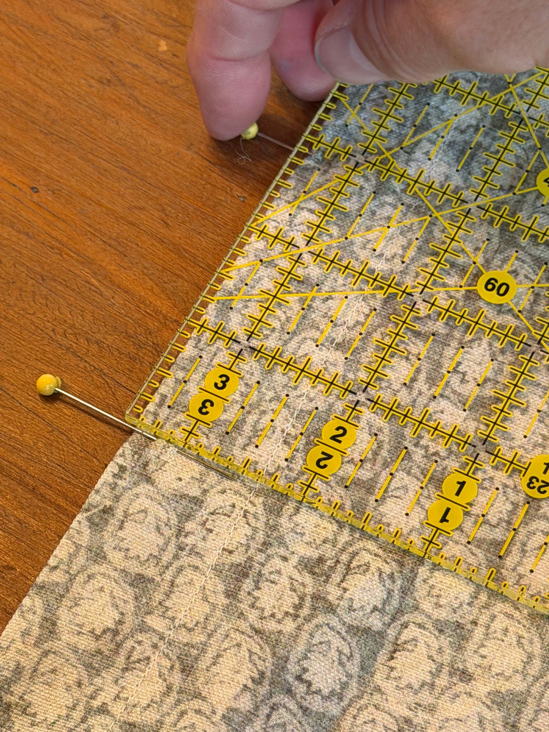 measuring 3" and marking with pins