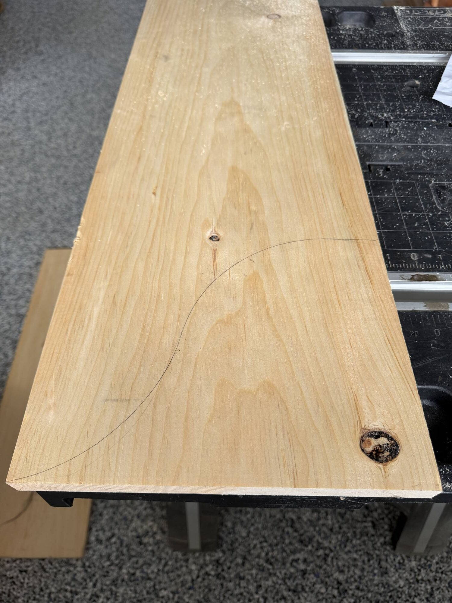 piece of pine with a scroll pencil mark on it