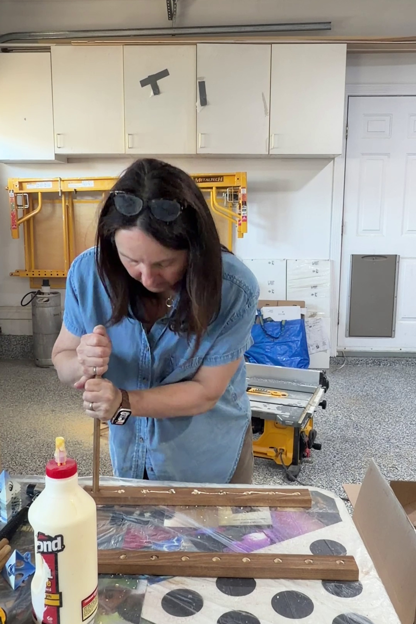 pushing dowel into dowel rail hole on diy plate rack