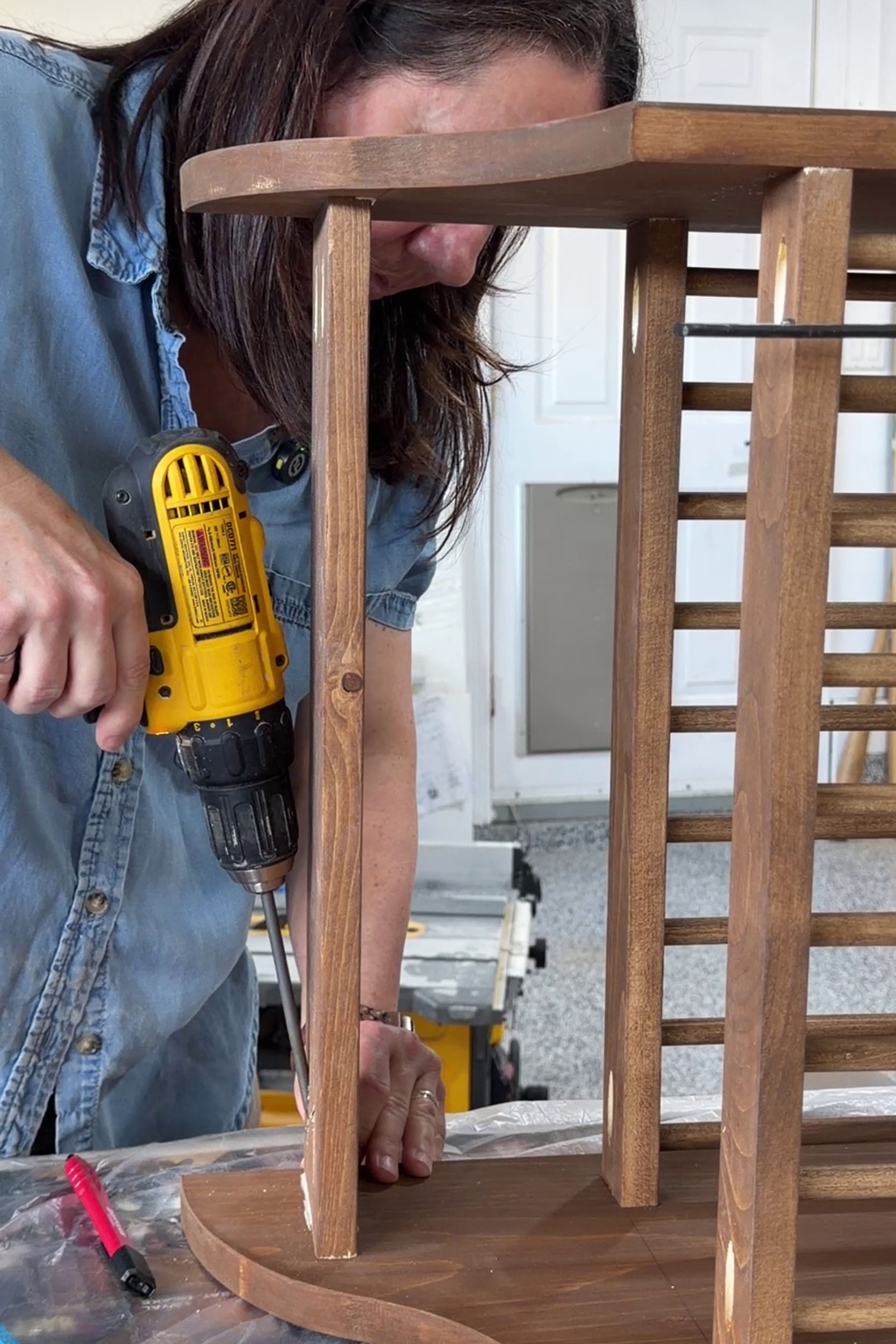 Girl screwing shelf in plate rack