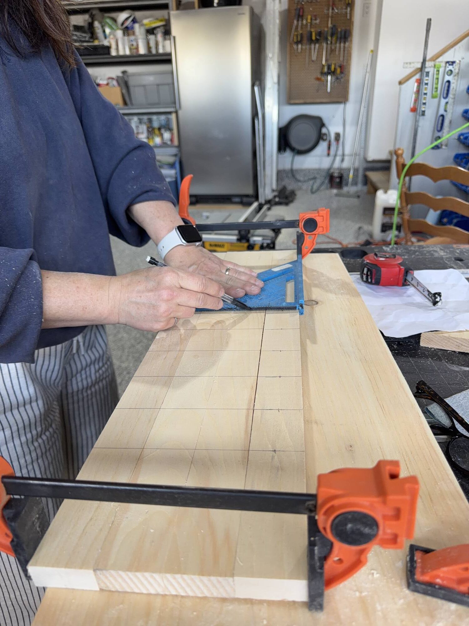 Marking a board with a pencil and square
